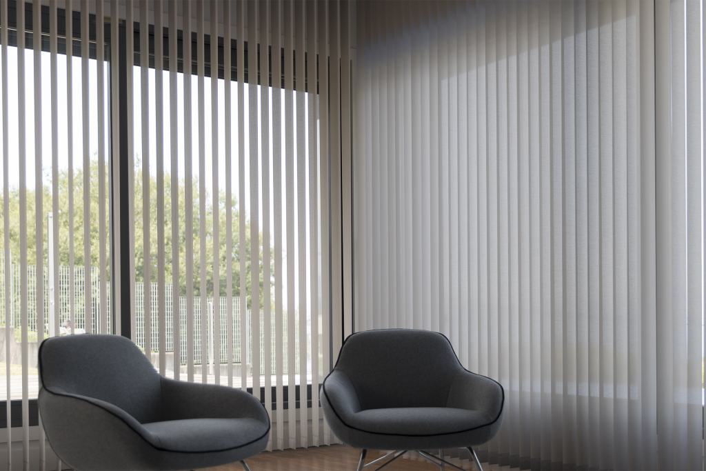 White polyscreen vertical blinds installed in a bright living room